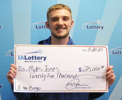 Myles Jones stopped to buy flowers on the anniversary of his grandfather's death and ended up winning a $25,000 lottery prize. Photo courtesy of the Iowa Lottery