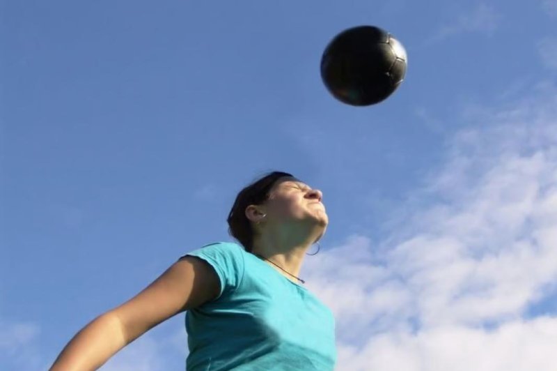 Bouncing a soccer ball off the head during play could be doing real damage to the brain, a new study suggests. Photo by Adobe Stock/HealthDay News